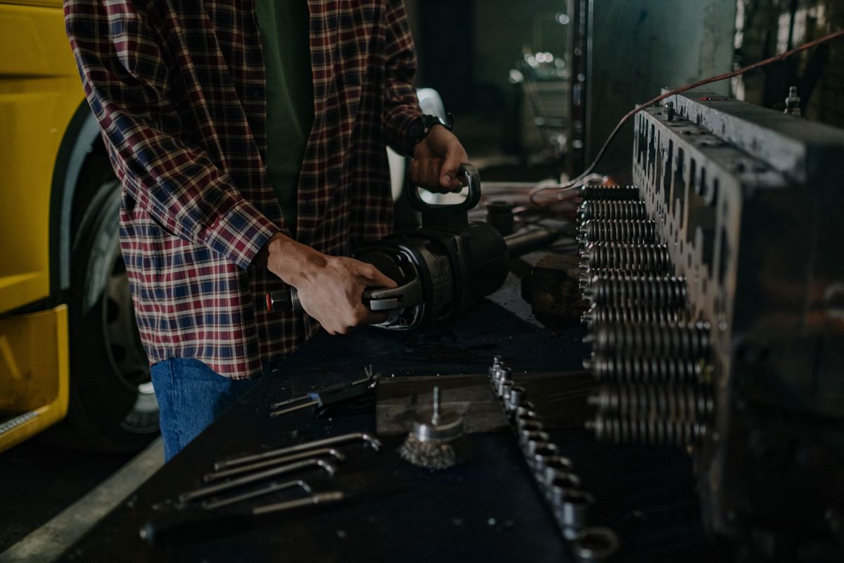 Mechanic working on a car in a workshop