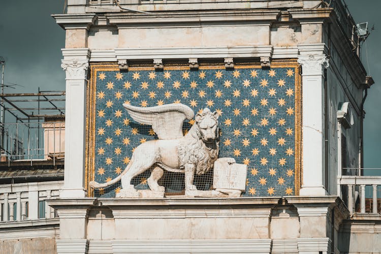 A Statue Of A Lion With Wings