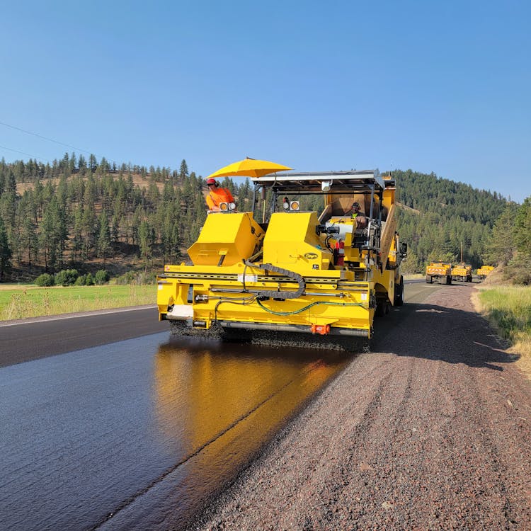 Yellow Tractor Working On The Road