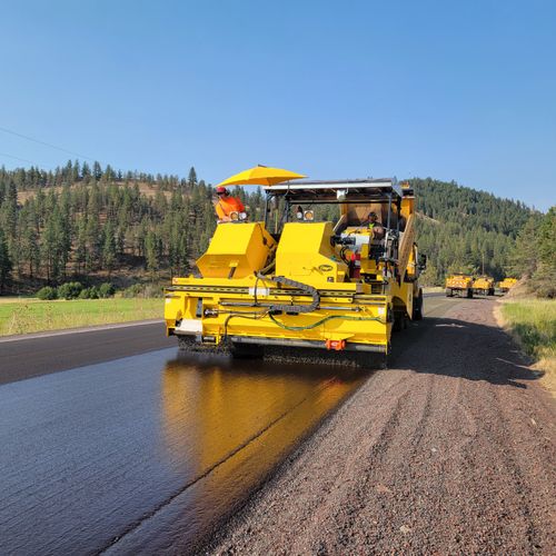 Free A paving machine laying asphalt on a rural road in Prineville, Oregon. Stock Photo