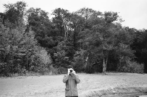 Free Monochrome Photo of a Man Taking a Picture Stock Photo