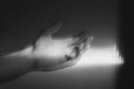 Grayscale Photo of Persons Hand