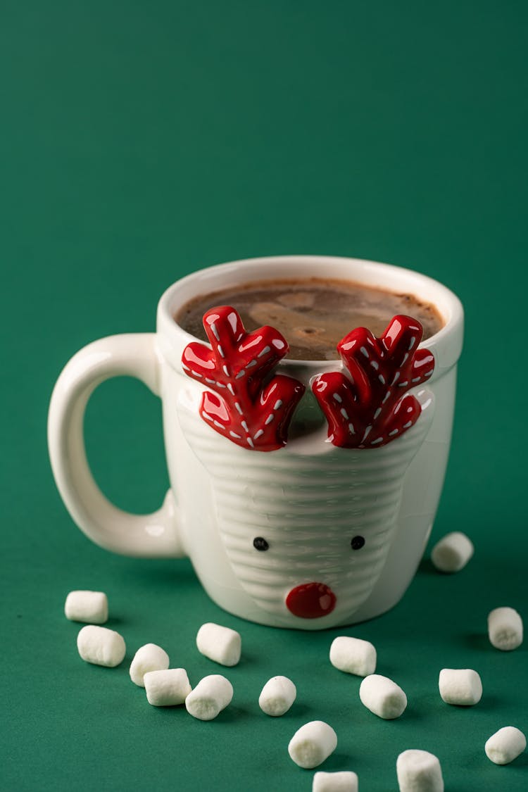 A Hot Chocolate On A Ceramic Cup Near The Scattered Marshmallows