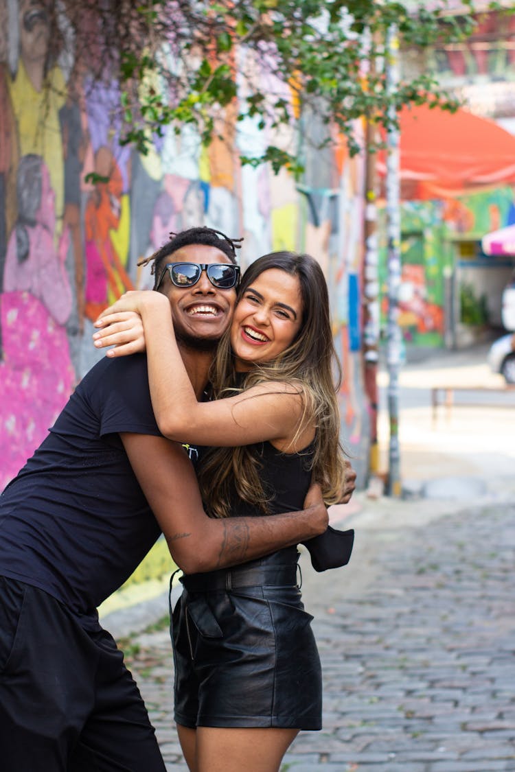 A Happy Man And A Woman Hugging Each Other