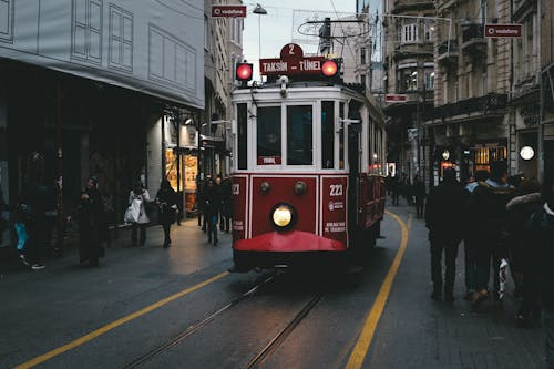 Free Red Tram Moving on the Road Stock Photo