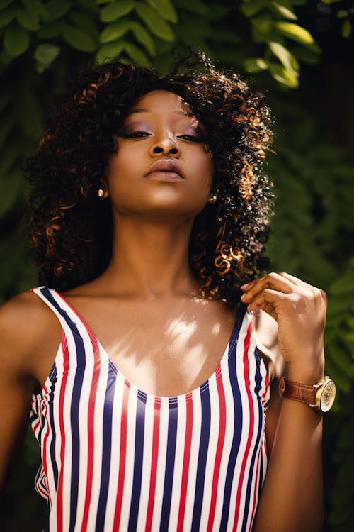 Woman in Blue, White, and Red Stripe Scoop Neck Sleeveless Top