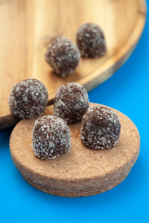 Round Shaped Chocolate Pastry on a Wooden Plate