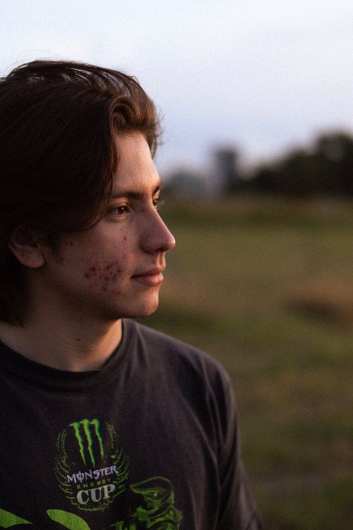 Free Side view portrait of a young man outdoors in Celaya, Mexico during twilight. Stock Photo