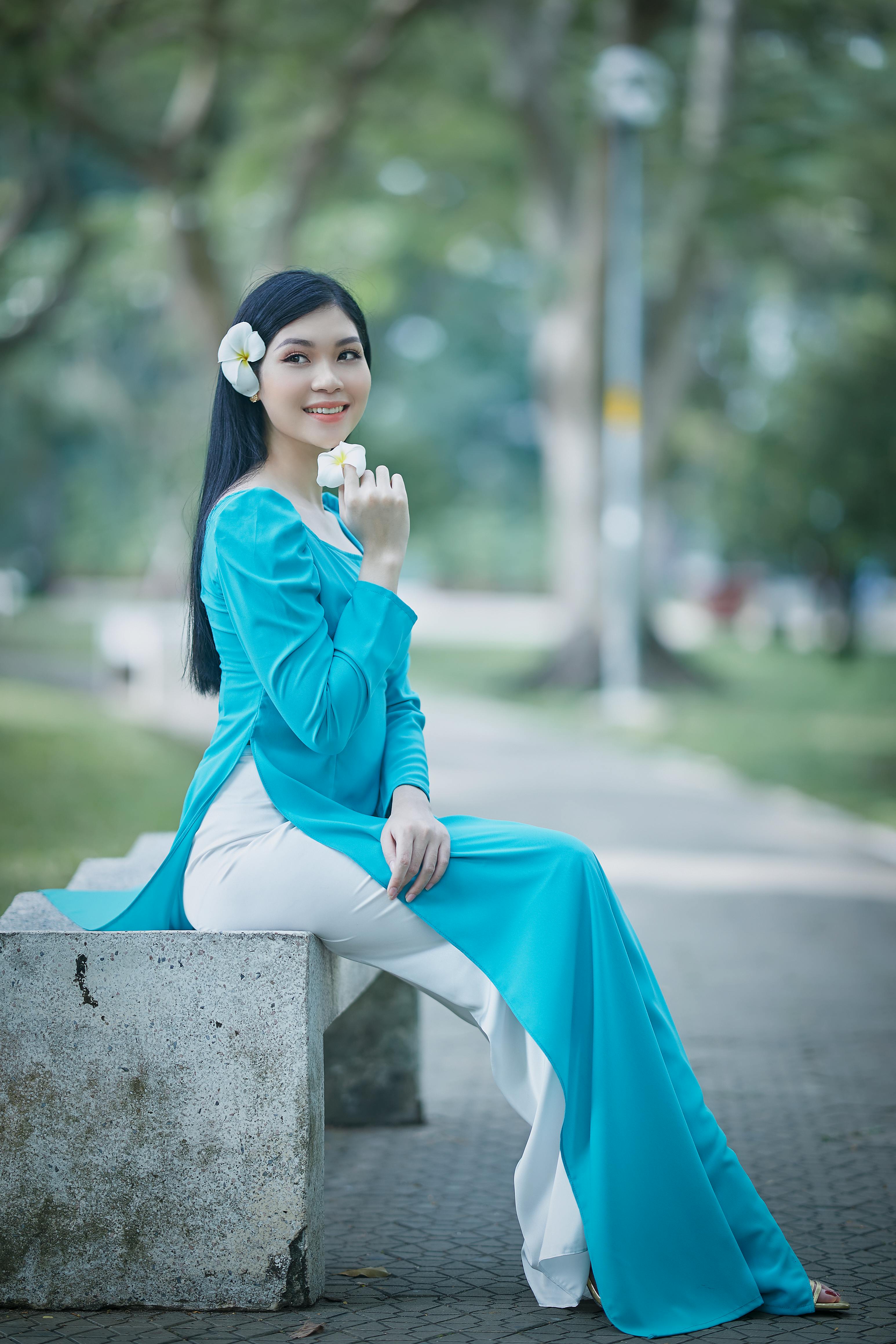 a beautiful woman in a blue ao dai