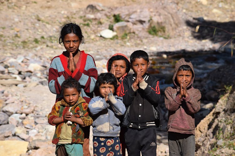 
Children With Their Hands In A Praying Position