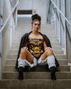 Portrait of Fashionable Woman Sitting on Steps