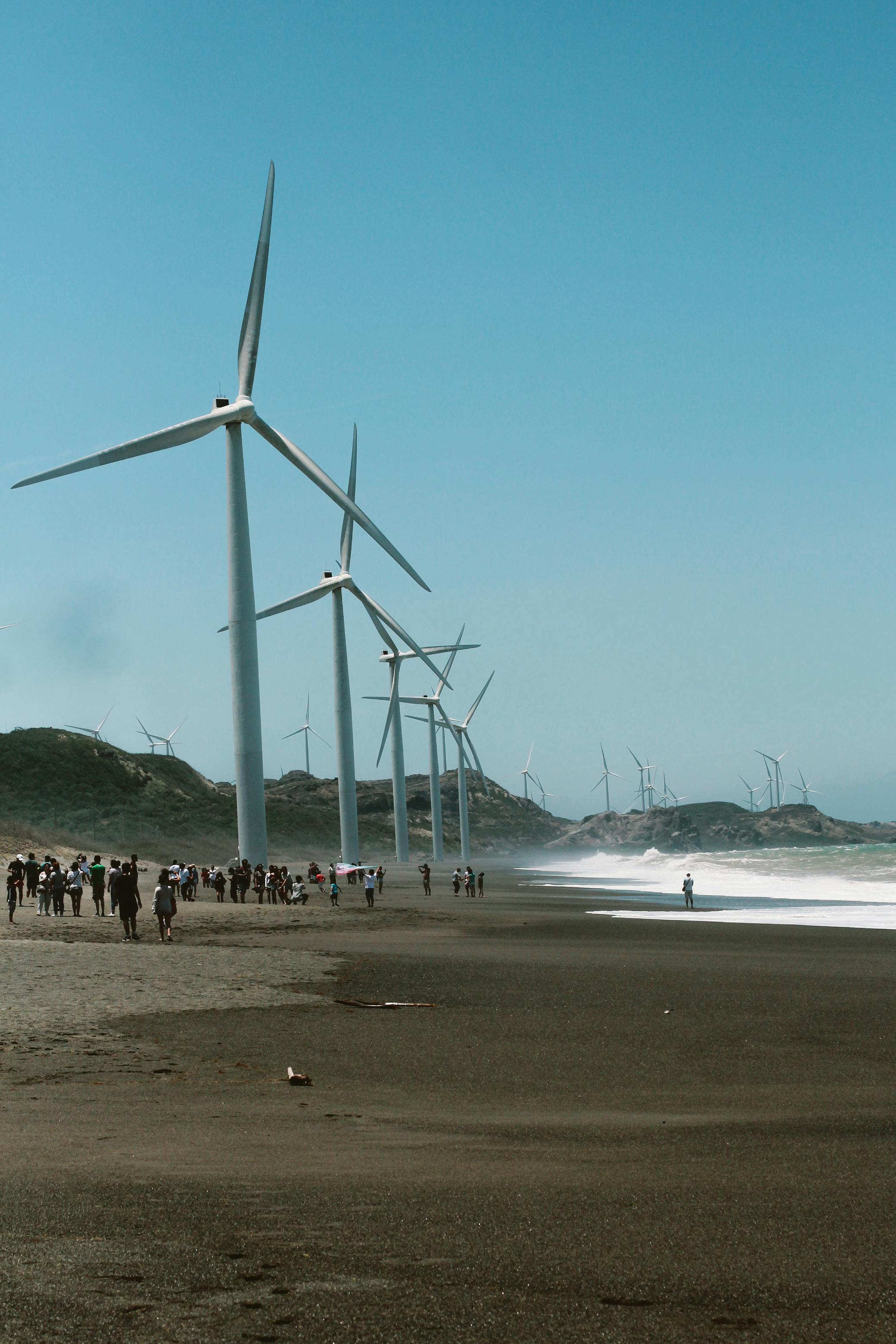 wind mills near the body of water