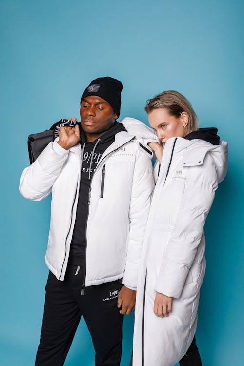 Man and Woman in White Jackets