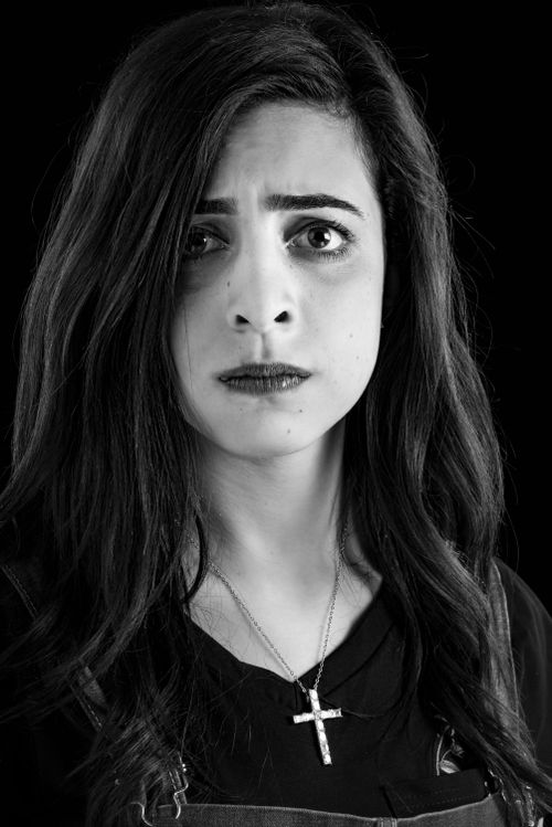 Free Black and white portrait capturing a woman's intense facial expression. Stock Photo