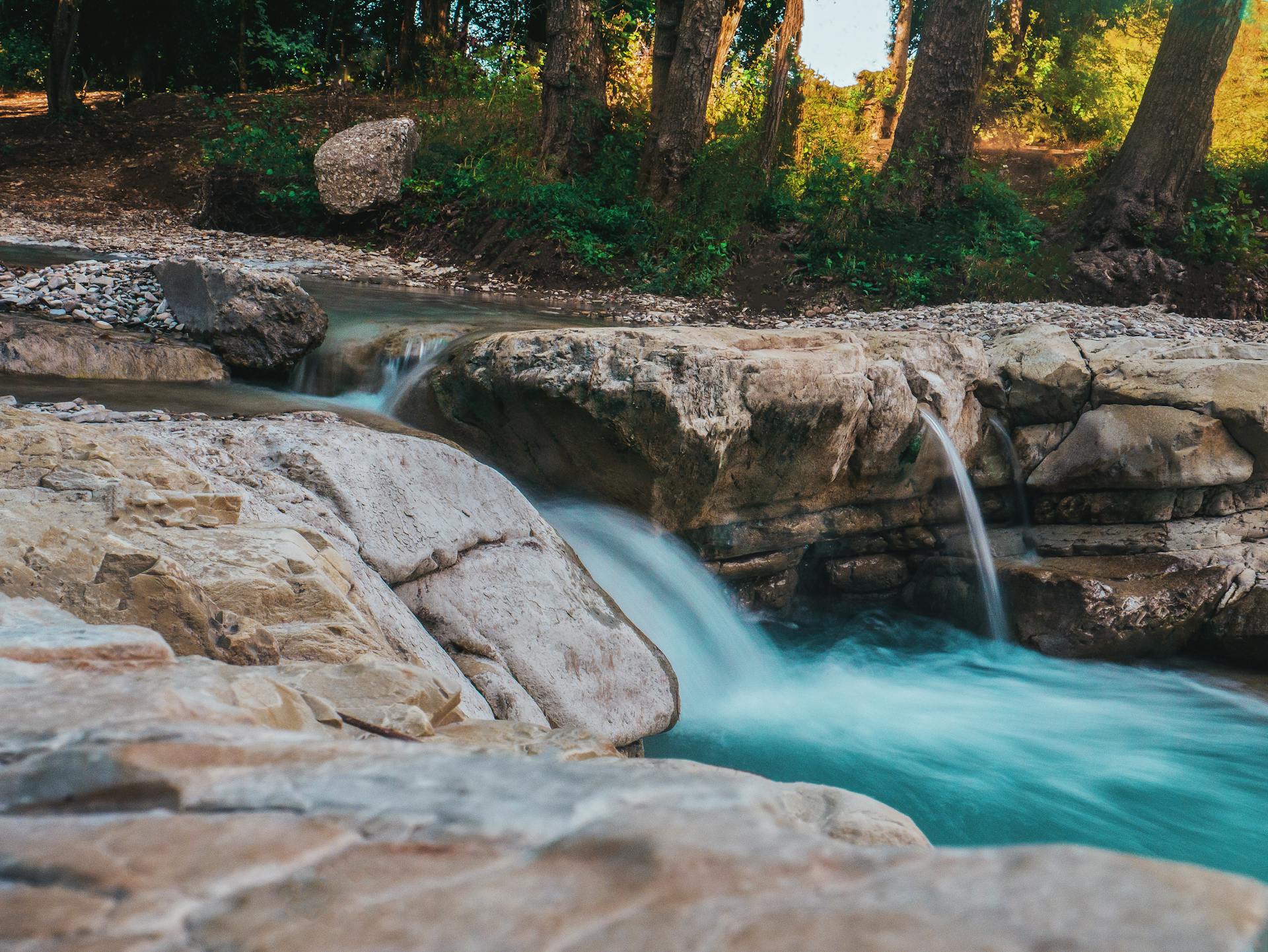 Photography of Water Flow Near Rocks