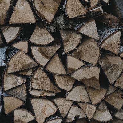 Stacked split firewood — photo by Nikolaeva Nastia on Pexels