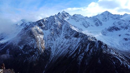Free Breathtaking view of snow-covered mountains in Terskol, Russia, capturing the serene beauty of nature. Stock Photo