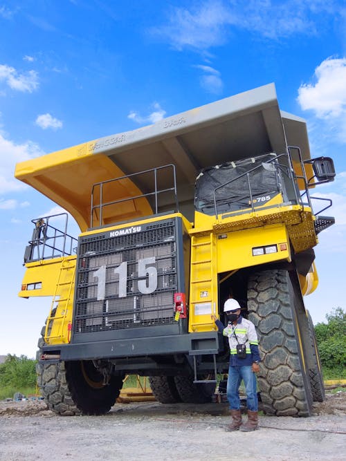 A Man Beside a Mining Truck