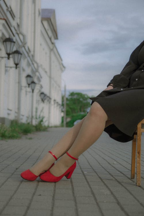 Woman in Black Dress Wearing Red Pumps · Free Stock Photo