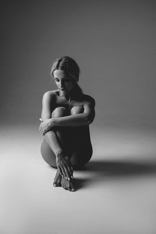 Free Black and White Portrait of Naked Woman Looking Down Stock Photo