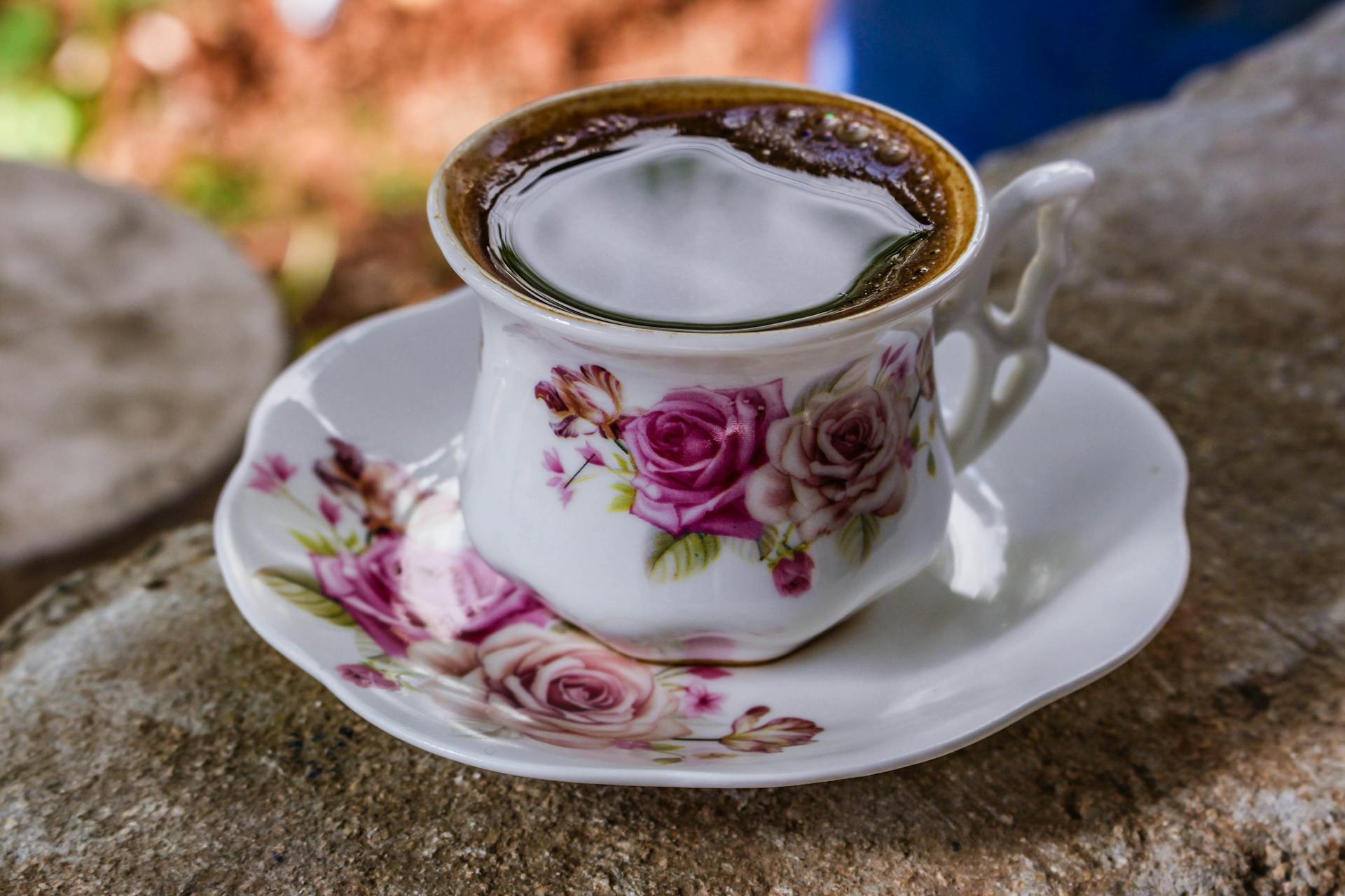 White and Pink Ceramic Floral Teacup With Saucer