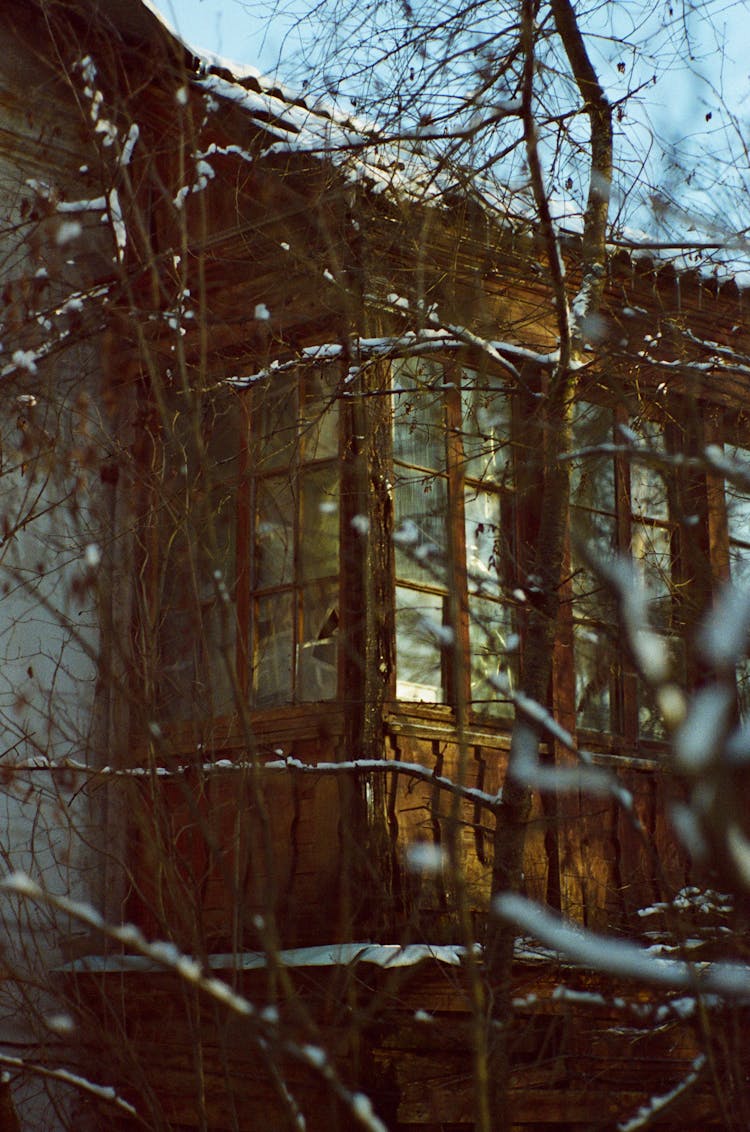 Old Wooden House In Winter Time 