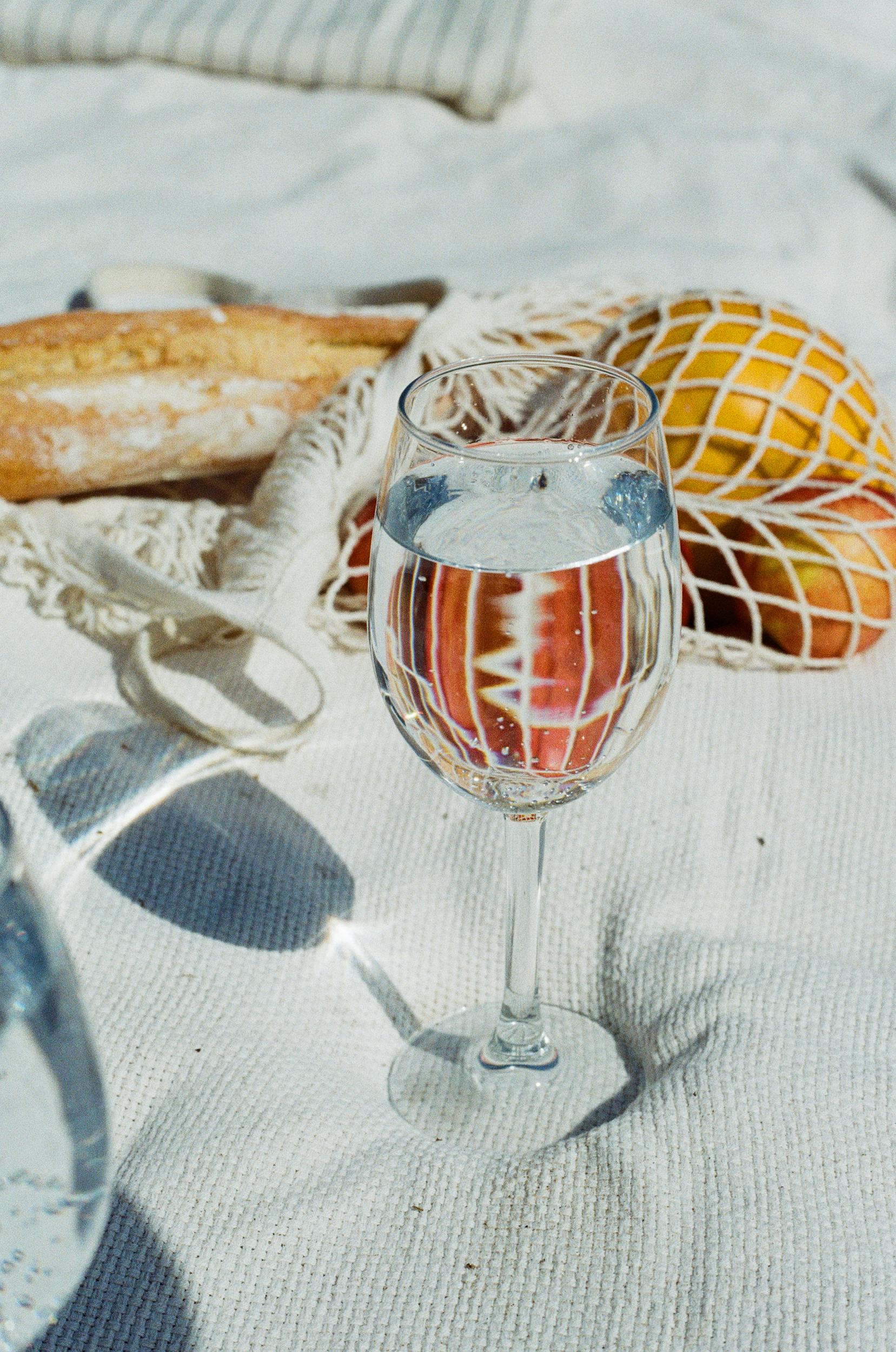 close up view of glass of water and fruits