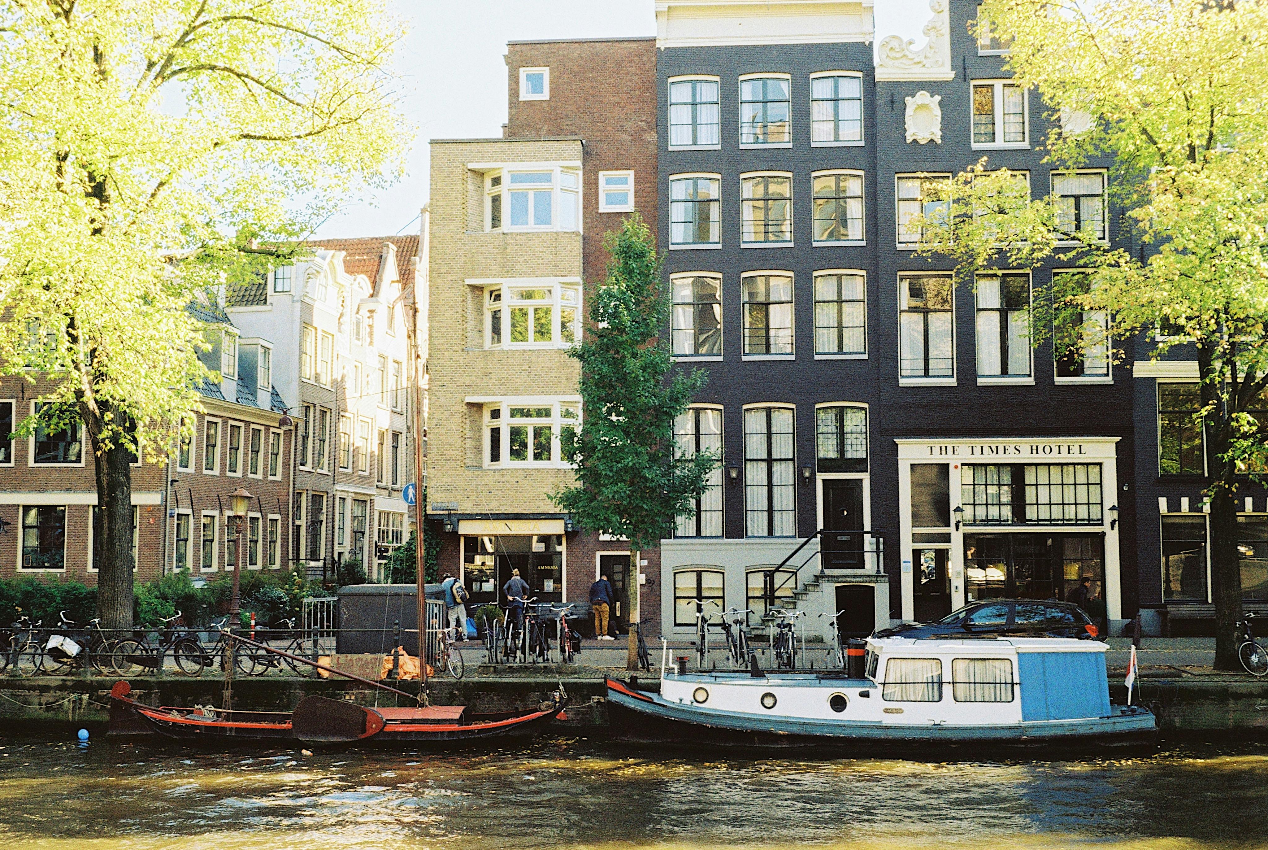 boats moored on canal in old town