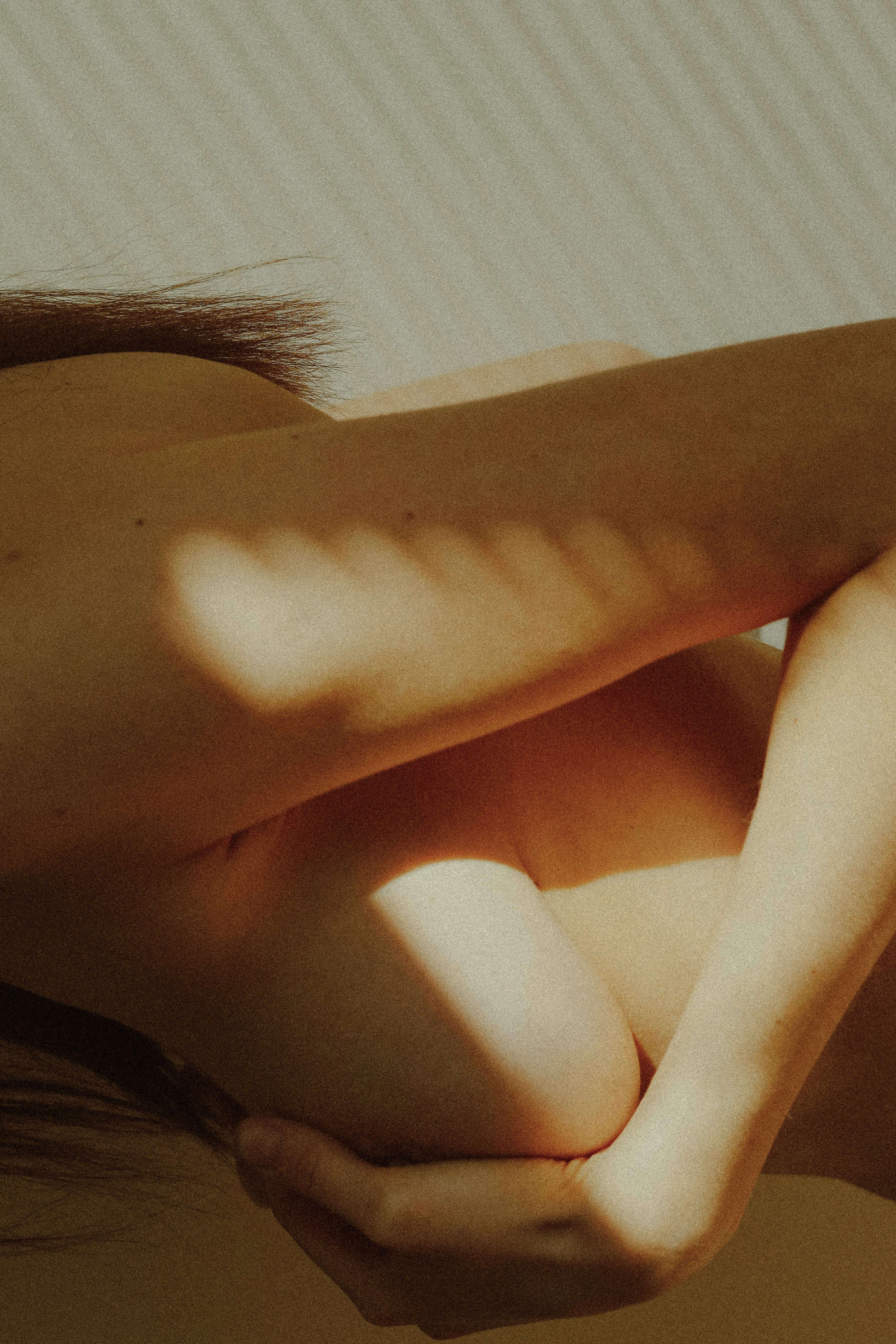 abstract image of a nude woman in sunlight and shadow