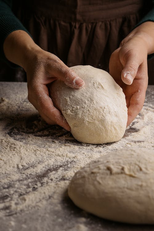 Person Holding White Dough in Close-up Photography