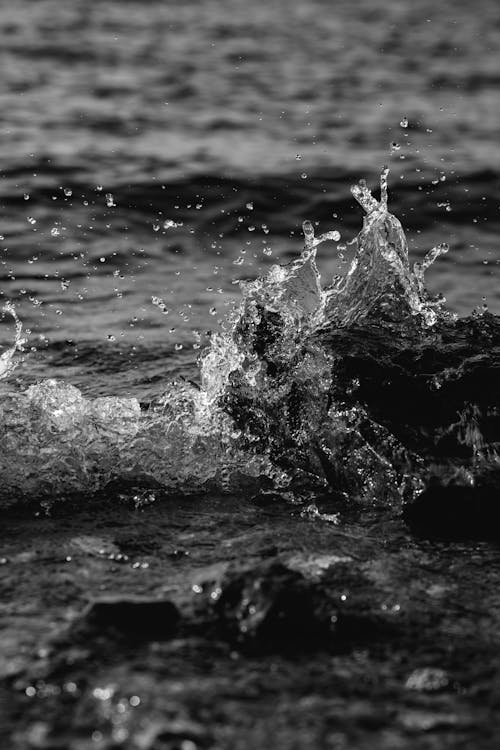 Grayscale  Photo of Water Splash on the Sea