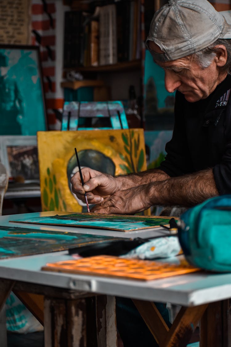 Photo Of A Man Painting