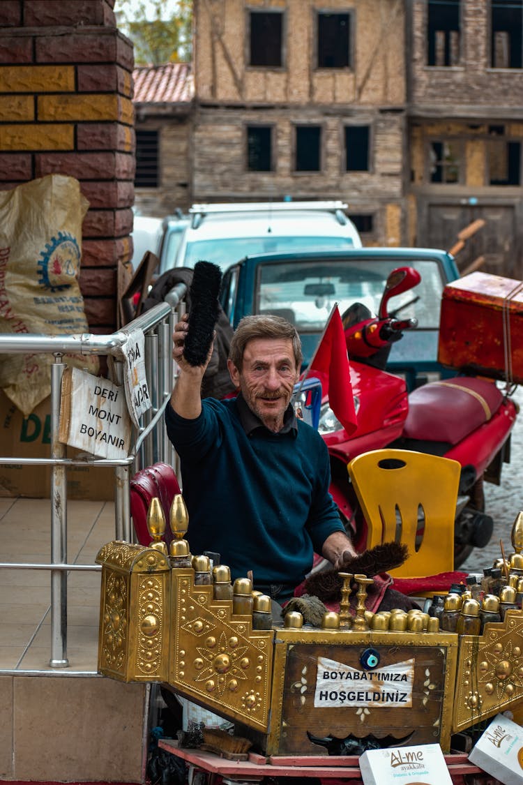 Shoe Polisher On City Street