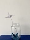 Clear Glass Jar With Blue and White Paper Plane