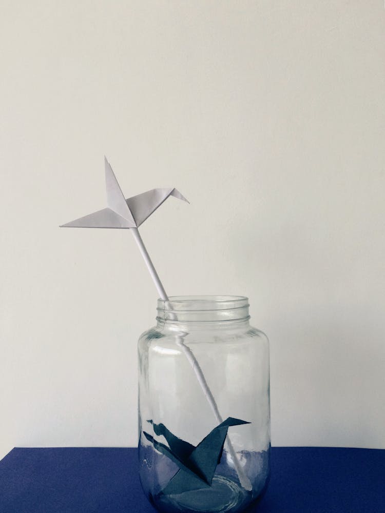 Paper Birds Inside A Glass Jar