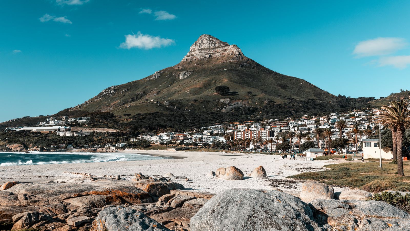 Beach near mountain under blue sky, South Africa