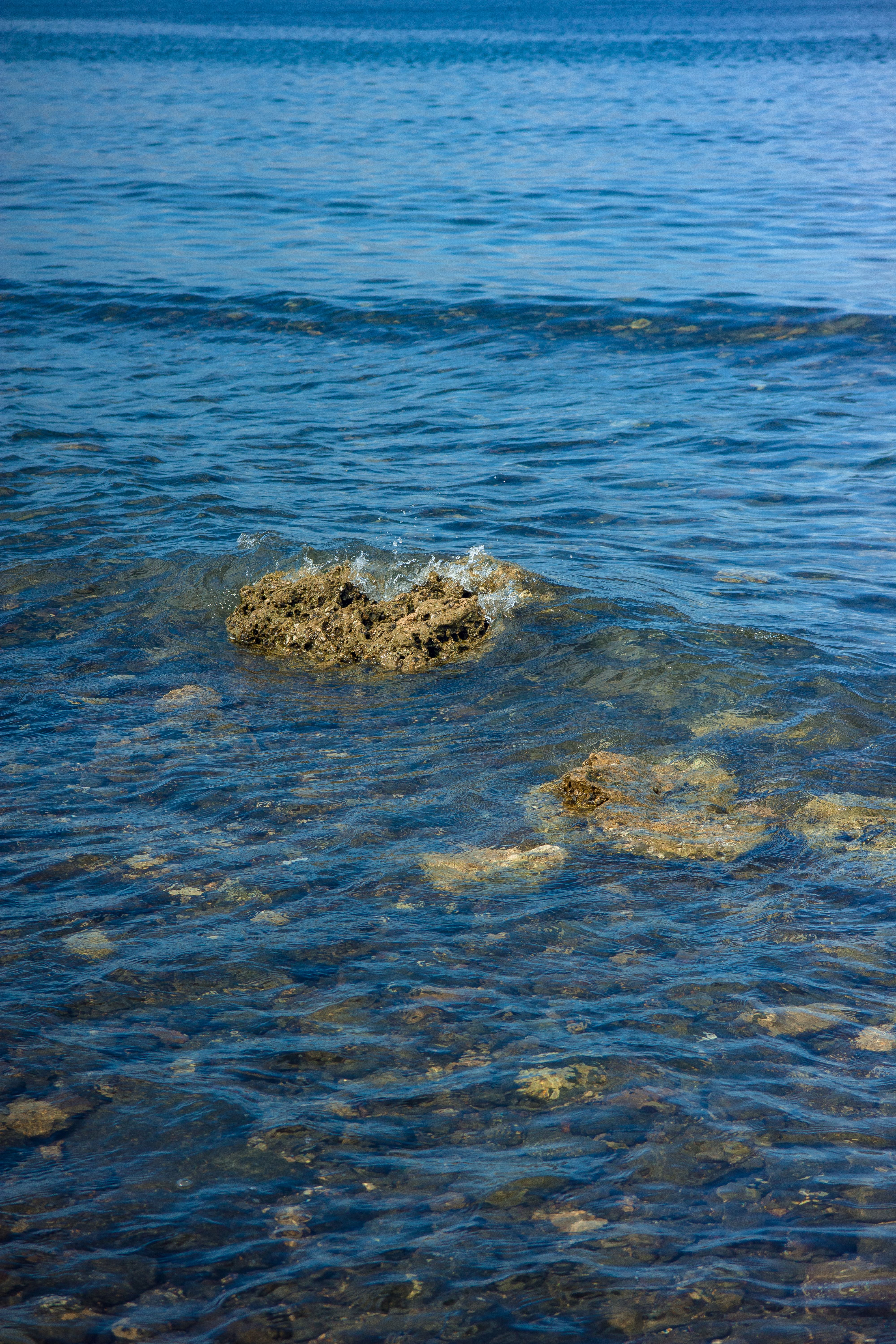 Rocks in a Body of Water · Free Stock Photo