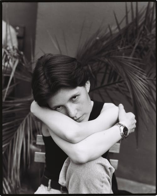 Black and White Woman Sitting on Chair