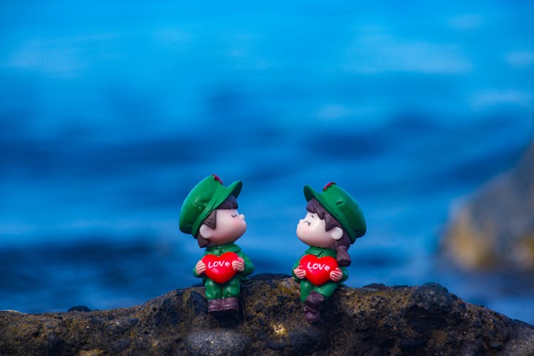 Toy Figures On Rock