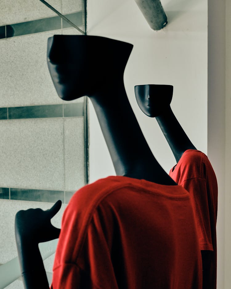 Close Up On Mannequins With Red Clothes