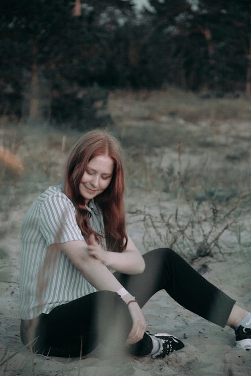 A Woman Sitting on Sand