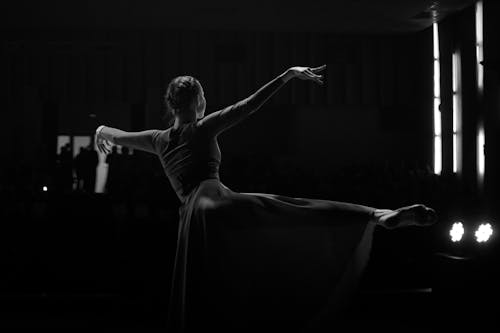 
A Grayscale of a Woman Dancing