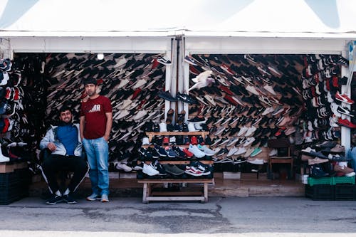 Men on a Shoe Stall