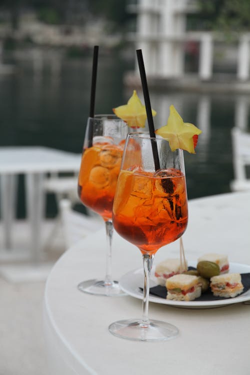 Selective Focus Photo of Two Cocktail Drinks with Straws