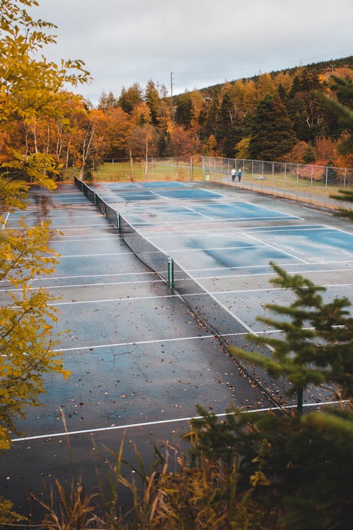 Free Wet Tennis Courts in Autumn Stock Photo