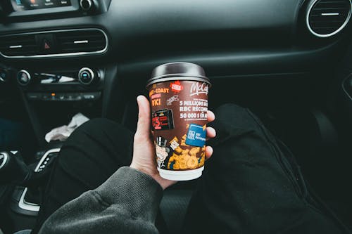 Close up on Coffee from McDonalds on Car