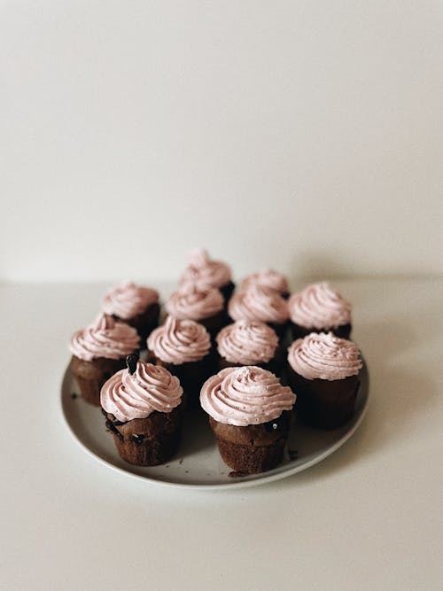 Cupcakes with Pink Icing Sugar on a Plate