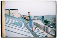 Woman in Blue Denim Jacket Standing on Top of Building