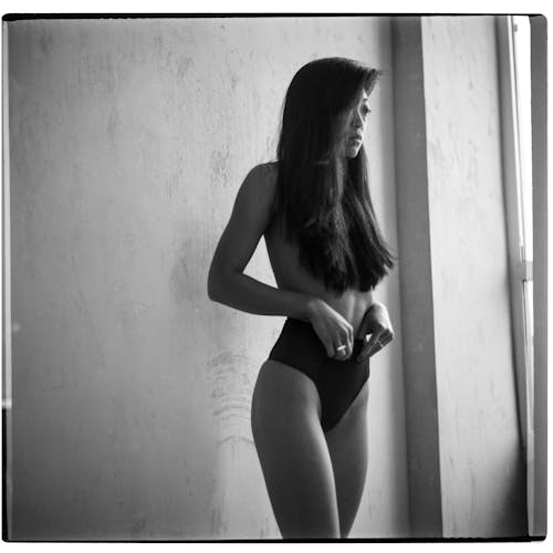 Monochrome Photograph of a Woman Wearing Underwear