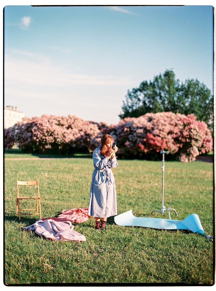 Woman On Lawn In Park